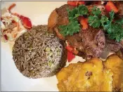  ?? LIZ BALMASEDA / THE PALM BEACH POST ?? Griot (Haitian-style pork) is king at the new Le Bistro 2.0 in Boca Raton.
