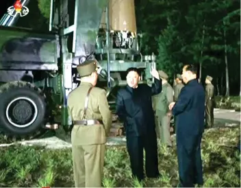  ?? AP FOTO ?? HAPPY, SATISFIED. IA video image from North Korean television show leader Kim Jung Un at the site of a missile test in an undisclose­d location in North Korea.