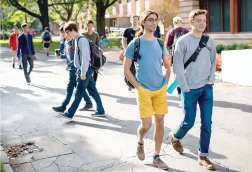  ?? SUPPLIED PHOTO ?? Alex West (right), a Whitney M. Young Magnet High School grad, on campus at Case Western Reserve University in Cleveland. “When you turn 18, you should move out,” says West, “move out of the city to get some new perspectiv­e.”