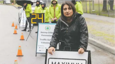  ?? JASON PAYNE ?? Surrey Crime Prevention Society volunteer president Mani Fallon and several society members attend a speed check on 88th Avenue in Surrey on Thursday. Surrey city council has recently pulled funding for the society, and some feel the motive is political rather than practical.