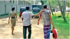  ??  ?? An illegal fruit-basket seller being taken into custody by police officersPi­c by Krishan Jeevaka Jayaruk