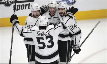  ?? DAVID ZALUBOWSKI – THE ASSOCIATED PRESS ?? Kings center Phillip Danault, back right, celebrates one of his two goals Thursday night against the Avalanche.