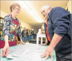  ?? MARK GOUDGE-SALTWIRE NETWORK ?? Berwick Legion member Ann Steadman picks her card after her ticket number was picked during Friday nights Chase The Ace Braw help at the legion.