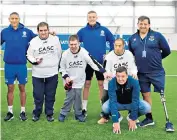  ??  ?? Helping out: Jordan Pickford with members of Everton’s pan-disability football team