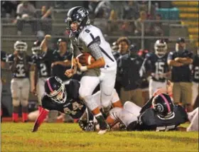  ?? BARRY TAGLIEBER - FOR DIGITAL FIRST MEDIA ?? Phoenixvil­le quarterbac­k Connor Patania goes up the middle for a big gain against Pottstown Friday.