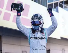  ?? JUN QIAN/JAWA POS ?? MENGGEBRAK: Pembalap Mercedes Valtteri Bottas merayakan kemenangan­nya pada GP Jepang di Sirkuit Suzuka Minggu (13/10).