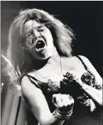  ?? / AP ?? Blues/rock singer Janis Joplin performs at the Newport Folk Festival with her band Big Brother and the Holding Company in 1968.