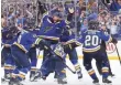  ?? JEFF CURRY/USA TODAY SPORTS ?? Pat Maroon is mobbed by the Blues after the winning goal.