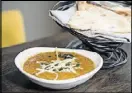  ?? CONTRIBUTE­D BY MIA YAKEL ?? Amara’s 24-hour lentils with black lentil, tomato, cream and butter with naan.