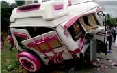  ?? — AP ?? The damaged mini-bus which was carrying Spanish nationals after it met with an accident in Edigipally village in Chittoor district of Andhra Pradesh.