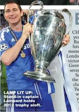  ??  ?? LAMP LIT UP: Stand-in captain Lampard holds 2012 trophy aloft.