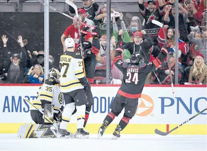  ?? GRANT HALVERSON/GETTY ?? The Hurricanes’ Seth Jarvis celebrates after scoring a goal against the Bruins in the second period of Game 1 on Monday night in Raleigh, North Carolina.