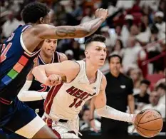  ?? Michael Laughlin / TNS ?? Tyler Herro of the Heat drives against the 76ers Wednesday. He had 18 points for Miami to help it to the Game 2 win.