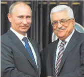  ?? Alexei Druzhinin / Associated Press 2012 ?? Russian President Vladimir Putin (left) meets with Palestinia­n President Mahmoud Abbas in 2012.