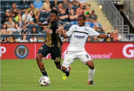  ?? MICHAEL REEVES — FOR DIGITAL FIRST MEDIA ?? Union midfielder Marcus Epps, left, tries to get by Harrisburg City midfielder Mouhammed Dabo Wednesday night at Talen Energy Stadium. Epps got his first start and scored his first goal in the 3-1 win over the Islanders in the fourth round of the U.S....