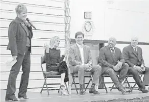  ?? JOHN MCCALL/SUN SENTINEL PHOTOS ?? Olympic Heights High School principal Kelly Burke introduces Alli Webb, Mark Cuban, Daymond John and Kevin O'Leary, all members of the television show Shark Tank, during a question and answer session at the school in Boca Raton, Monday. After student Madison Borman won a sweepstake­s offered by the show, the cast made an appearance at her school to talk with students.