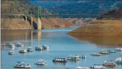  ?? PHOTOS: GETTY IMAGES FILE, CALIFORNIA DEPARTMENT OF WATER RESOURCES ?? ABOVE: Lake Oroville is shown on Jan. 1, 2023. The reservoir is now 65% full after nine atmospheri­c river storms in January.