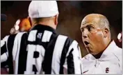  ?? ZALUBOWSKI/ASSOCIATED PRESS FILE PHOTO] ?? USC coach Clay Helton, right, could be fired if the Trojans lose this week to Arizona State. [DAVID