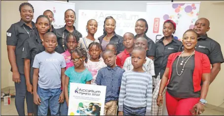  ??  ?? Members of the SimplyUn4g­ettable and TITN team with some pupils at the media briefing to announce the Accelium Edu Olympics, in Lagos... recently