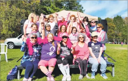  ?? N.F. Ambery / For Hearst Connecticu­t Media ?? Breast cancer survivors, cheerleade­rs, and disc jockeys Patti and Brad Adkins warmed up the crowd during an opening ceremony prior to the walk.