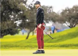  ?? MEG MCLAUGHLIN U-T ?? Sam Ryder, sporting maroon joggers with ankle socks, lines up a putt on the green of the fifth hole during the final round of the Farmers Insurance Open.