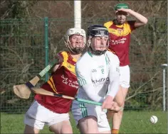  ??  ?? Jack Fortune of St. Peter’s tries to avoid a hook from Jamie Ryan.