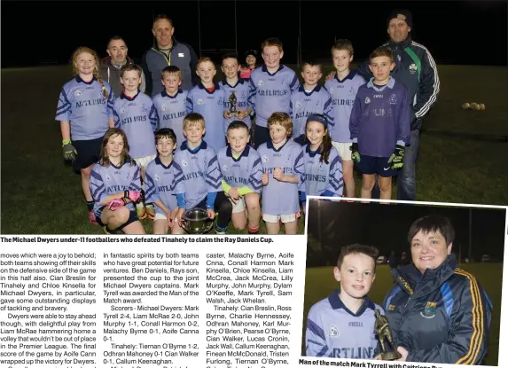  ??  ?? The Michael Dwyers under-11 footballer­s who defeated Tinahely to claim the Ray Daniels Cup. Man of the match MarkTyrrel­l with Caitriona Byrne.