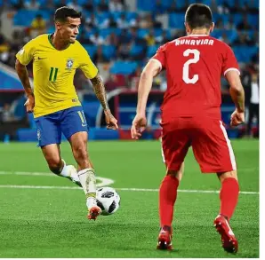  ??  ?? Turning on the style: Brazil’s Philippe Coutinho making a fancy flick in front of Serbia’s Antonio Rukavina in the Group E match at the Spartak Stadium on Wednesday. — AFP
