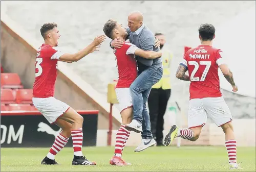  ??  ?? PASSIONATE: Patrick Schmidt’s late winner for Barnsley against Nottingham Forest which helped keep them in the Championsh­ip prompted boss Gerhard Struber to run on the pitch.