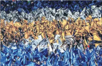  ?? Photo: Richard Heathcote/Getty Images ?? Flying high: Exuberant Leicester City fans before the UEFA Champions League quarterfin­al second leg match against Atletico Madrid, which ended their dream run.