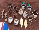  ??  ?? Above: The 1980s is her favourite fashion era and all of these statement earrings date from that period