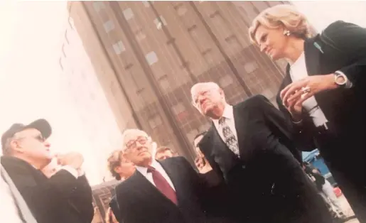  ?? PROVIDED PHOTO ?? Then-New York Mayor Rudy Giuliani (from left), Henry Kissinger, George Ryan and Michael Sneed at Ground Zero soon after Sept. 11, 2001.