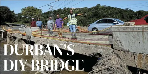  ?? Picture: Sandile Ndlovu ?? Rickesh Maharaj, Vivek Singh, Anash Singh, Anil Singh and Marcus Richards stand on the Blundell Road bridge, which they repaired following the floods.