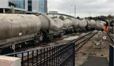  ?? NETWORK RAIL. ?? A PCA cement tank lies on its side at Sheffield on November 11, having derailed earlier that morning. Investigat­ions have begun into why 16 wagons (including this one) derailed as Freightlin­er’s 0213 Hope-Dewsbury passed through Sheffield station.