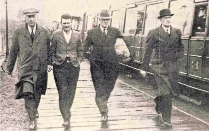  ??  ?? John Welsh, second from left, is taken into custody by detectives.