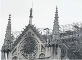  ?? PHOTO: AP ?? The blackened shell of Notre Dame cathedral after the fire yesterday.