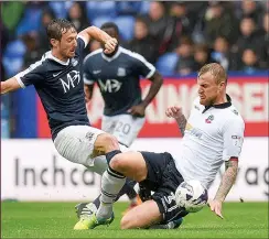  ??  ?? BATTLE: Bolton’s David Wheater tackles Southend’s David Mooney