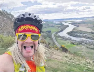  ??  ?? Pedal power Michael Souter, dressed as Hulk Hogan, took on a gruelling challenge up Kinnoull Hill