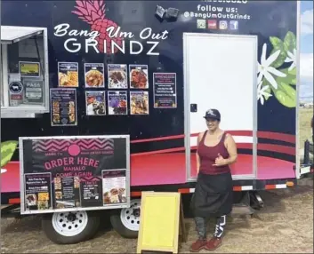  ??  ?? Tiara Dudoit, owner of Bang Um Out Grindz food truck, managed to serve 150 meals to first responders in West Maui with the equipment she had on hand for a Lahaina holiday staycation.