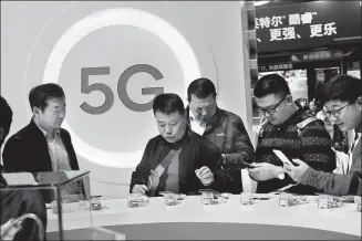  ?? JIN RONG / FOR CHINA DAILY ?? A 5G-tech promotion stand at the recent China Internatio­nal Import Expo in Shanghai.