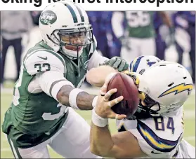  ?? AP ?? MINE! Jamal Adams (left) and the Chargers’ Sean McGrath fight for the ball in the Jets’ 14-7 loss at MetLife Stadium on Sunday.