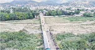  ?? AFP ?? An aerial view shows the Simon Bolivar Internatio­nal Bridge between Cucuta, Colombia and San Antonio de Tachira in Venezuela, in 2019, as seen from Cucuta.