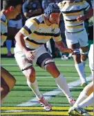  ??  ?? Robert Paylor, who suffered a serious neck injury in a 2017 rugby game, graduated from Cal’s Haas School of Business last month.