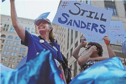  ?? STAFF PHOTO BY NANCY LANE ?? DNC DIVIDE: Supporters of Vermont U.S. Sen. Bernie Sanders protest outside City Hall as the Democratic National Convention gets under way in Philadelph­ia yesterday.