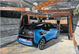  ??  ?? The i3 now offers a claimed range of up to 200km for the pure electric version and 360km for the range extender. Below: The i8 Roadster is a definite head-turner.