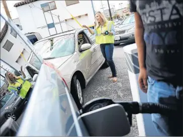  ?? Christina House Los Angeles Times ?? THE INCREASE in gasoline prices is partly because of reduced production from the Organizati­on of the Petroleum Exporting Countries. Above, motorists wait to fuel up at a gas station in Burbank in 2015.