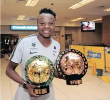  ??  ?? THEMBI this week with her collection of CAF awards, including the African Women’s Player of the Year and Goal of the Year. | RYAN WILKISKY Backpagepi­x