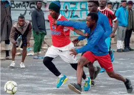  ?? — AFP ?? Migrants play football in the Oulad Ziane camp in Casablanca, Morocco.