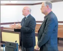  ?? JULIA M. DENDINGER/NEWS-BULLETIN ?? Los Lunas attorney Michael Sanchez, left, talks with the judge as his client, Ed Auge, right, looks on. Auge pleaded guilty to embezzleme­nt and conspiracy.