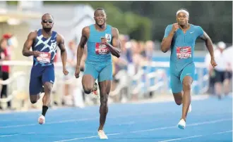  ?? AP ?? Aaron Brown (right) races to the win ahead of Jerome Blake (centre) who finished second, and Bismark Boateng, who finished seventh, during the men’s 100m at the Canadian Track and Field Championsh­ips in Langley, British Columbia on Saturday, June 25.